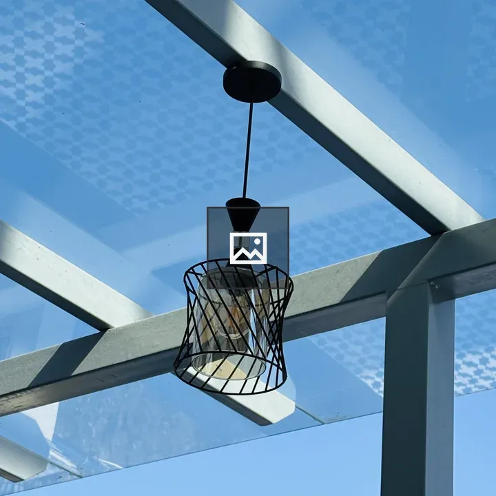 Modern pendant light in glass ceiling