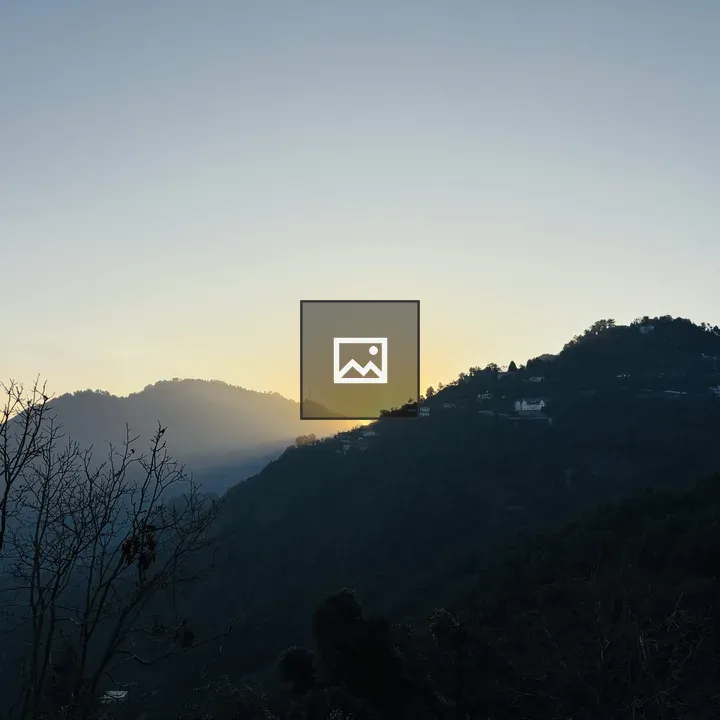 Sunrise Behind Hills and Trees