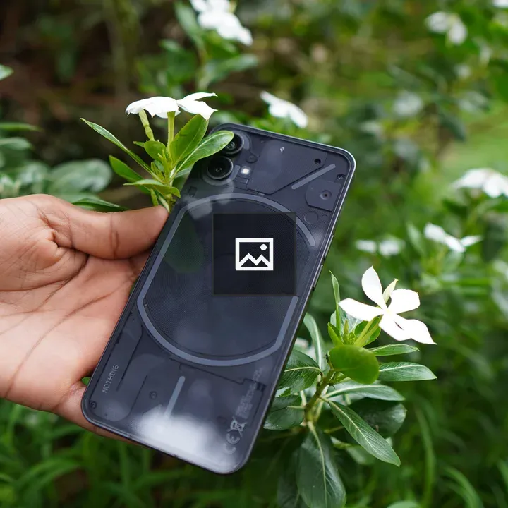 Holding Phone with Flowers Backdrop