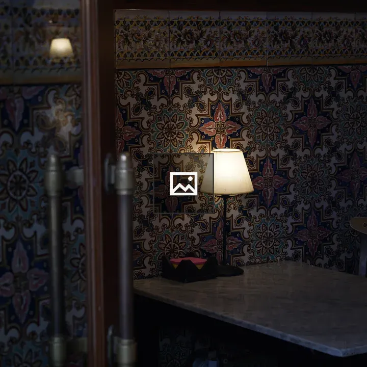 Small cozy café table with lamp