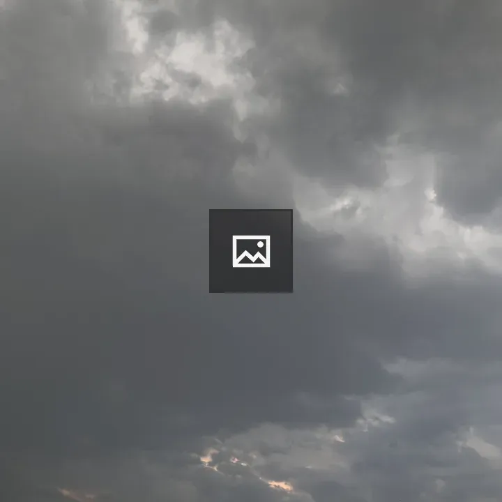 Moody sky with water-tank silhouettes