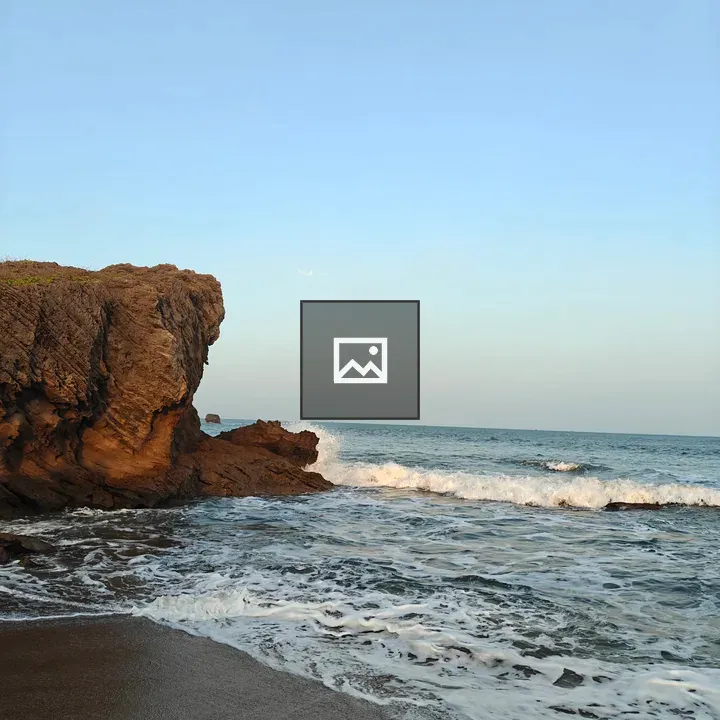 Waves at Jagged Coastal Rocks