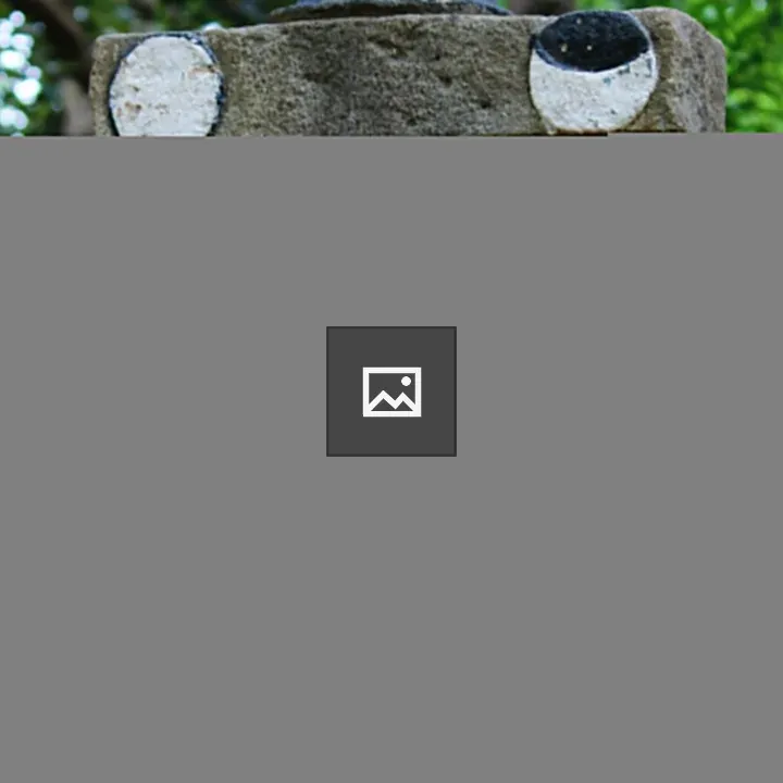 Ancient statue among trees