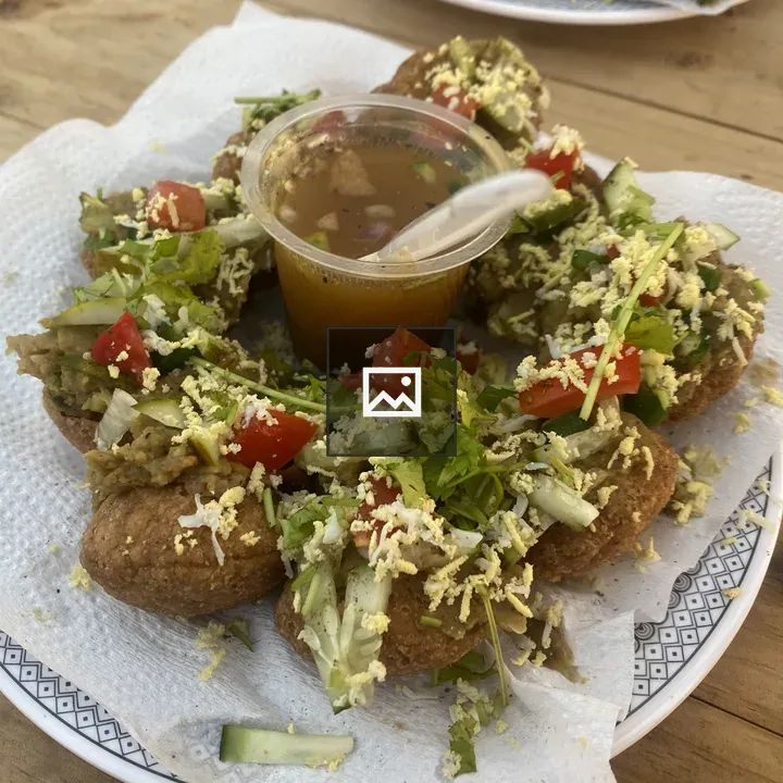 Plate of stuffed puris with tamarind dip