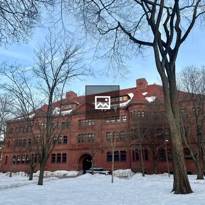 Snowy landscape with red brick building