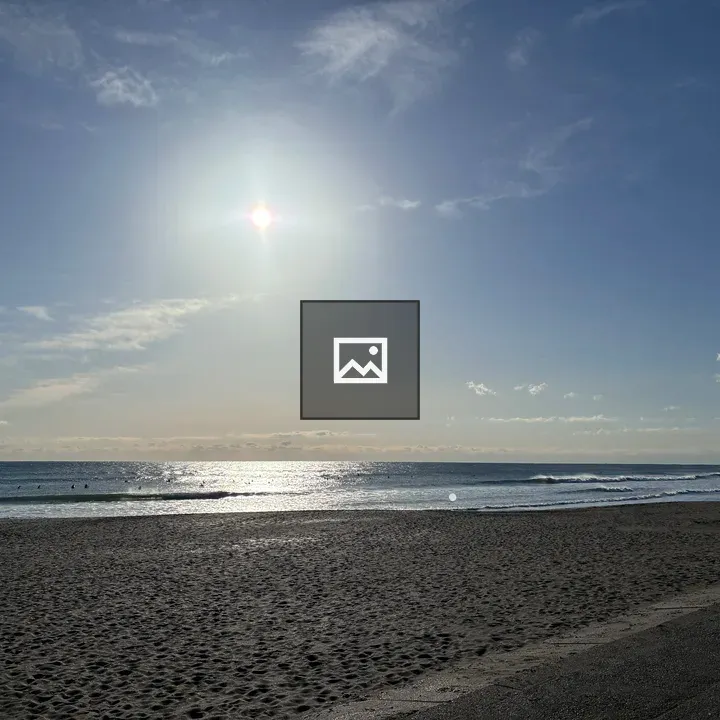 Serene Beach Scene with Surfers