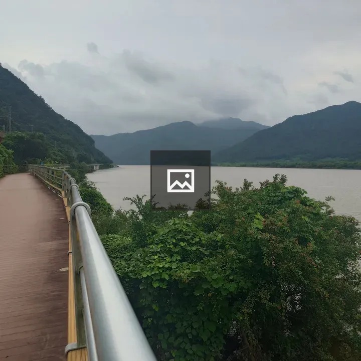 Brown bike path by river