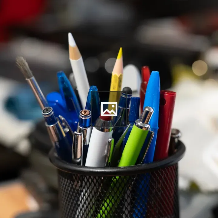 Various writing utensils in a pen pot