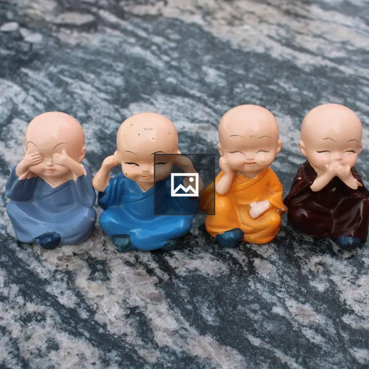 Monk figurines in colorful robes