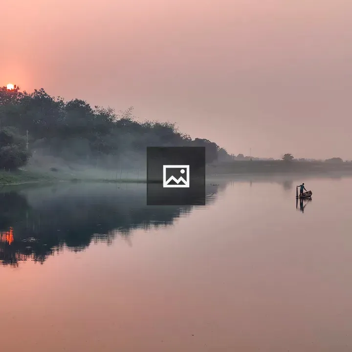 Serene river sunset with boat