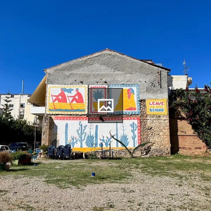 Wall mural with 'Leave No One Behind'