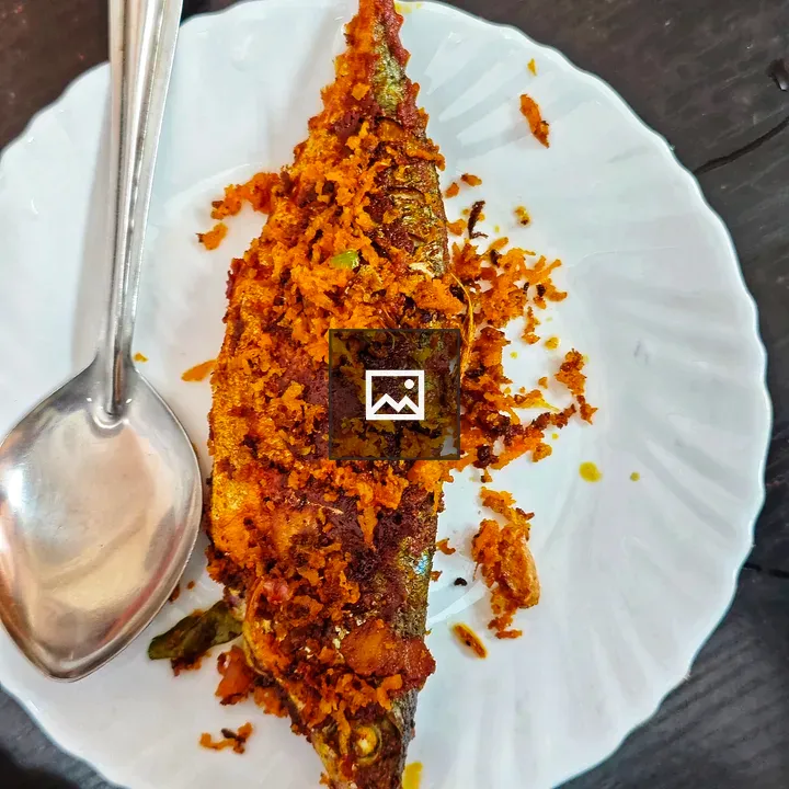 Fried mackerel on white plate