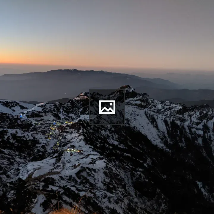 Sunrise over snowy Kuri Village mountains