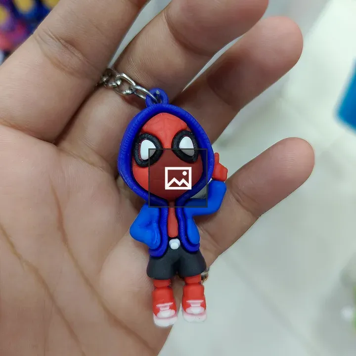 Hand Holding Spider-Man Keychain