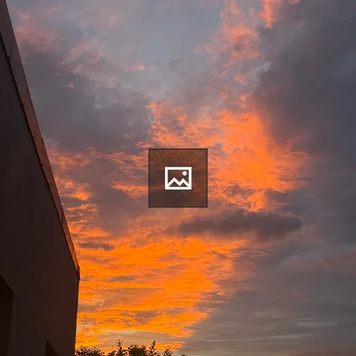 Orange sunset over clouds