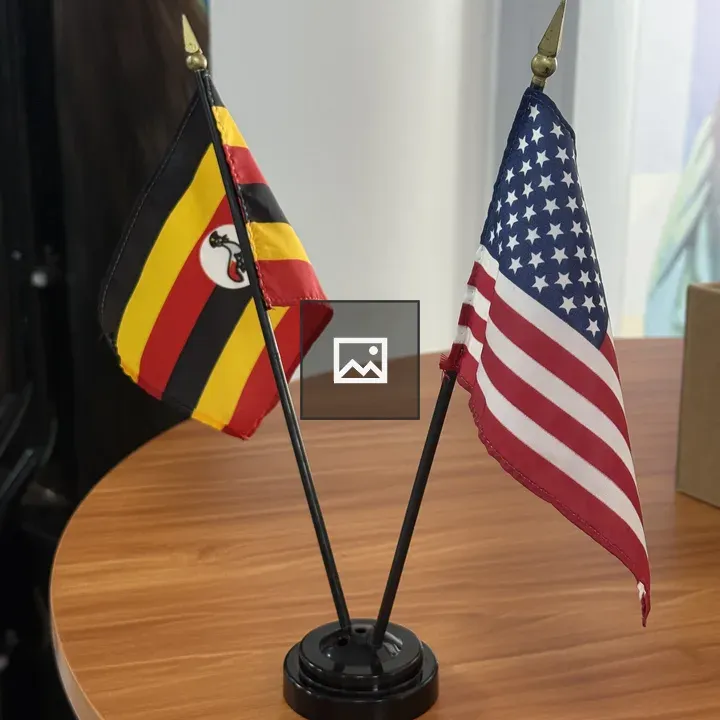 Uganda and USA Flags on Table