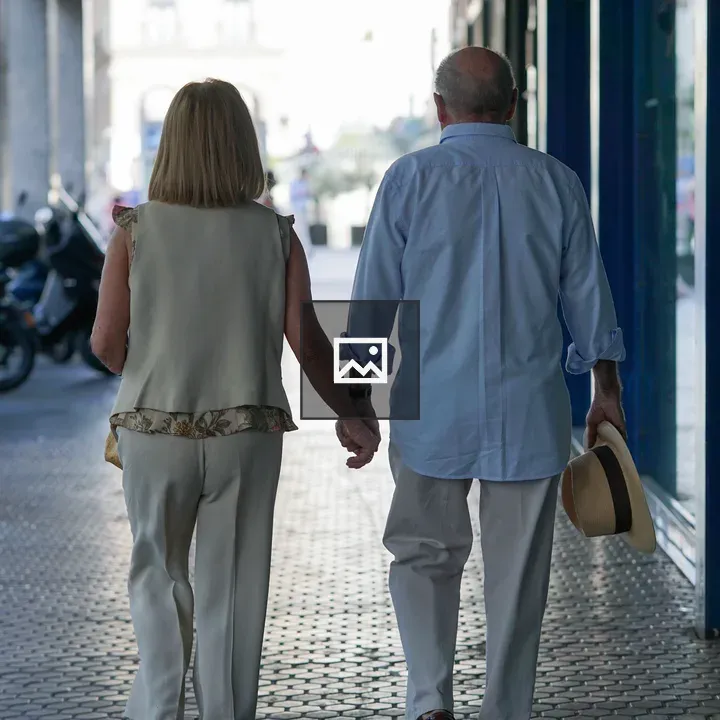 Senior couple walking hand in hand