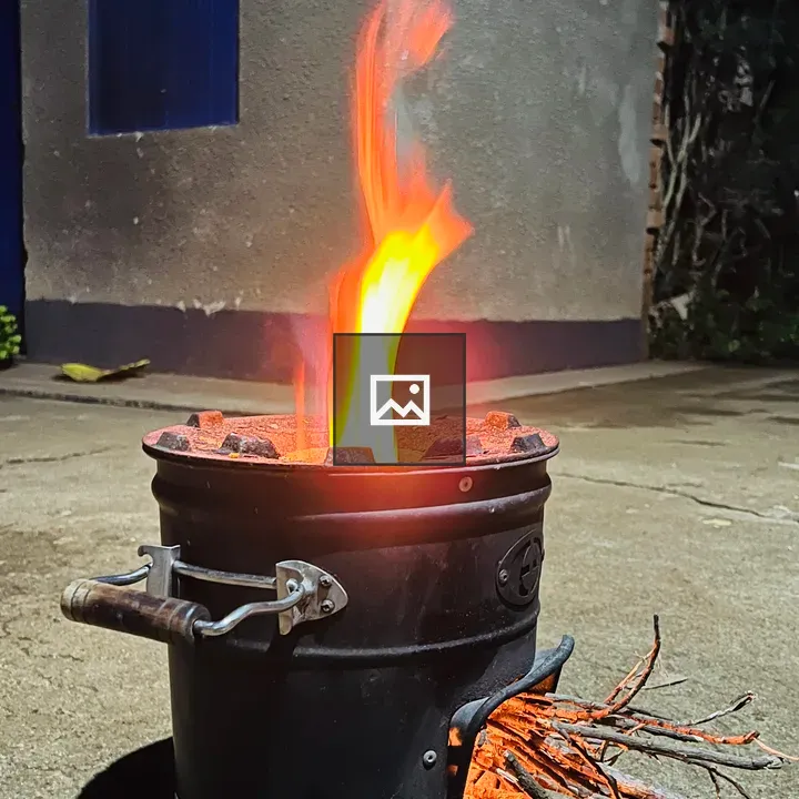 Black metal stove on concrete