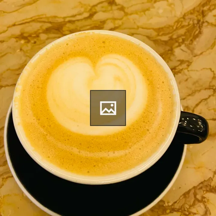 Cup of cappuccino with heart foam