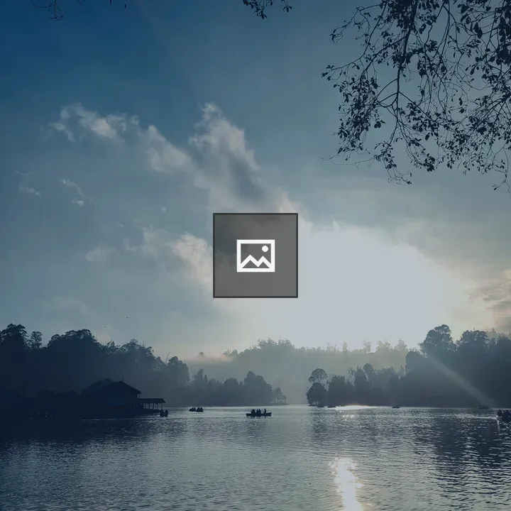 Sunrise Over Misty Water with Silhouettes