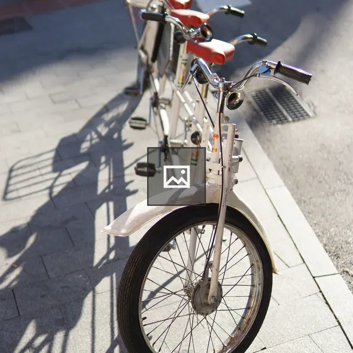 White four-person tandem bicycle