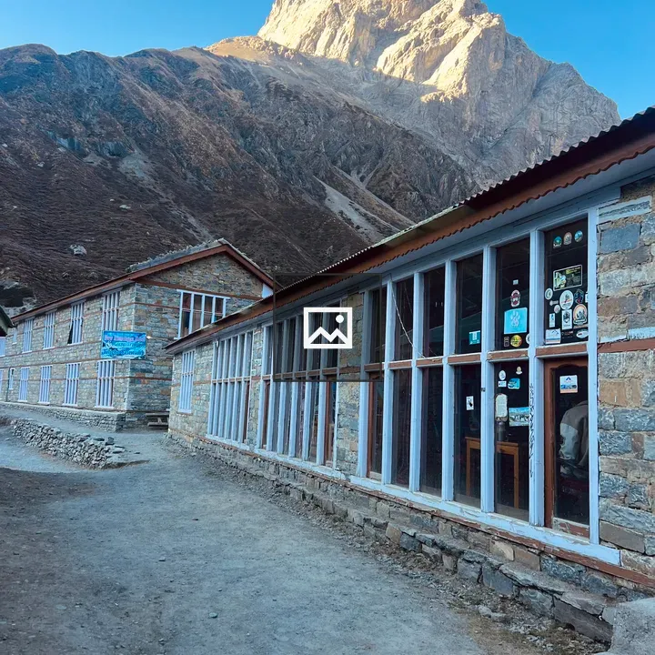 Stone buildings along a dirt path