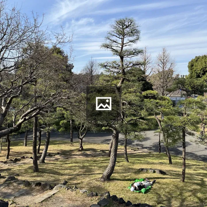 Two People on Green Blanket