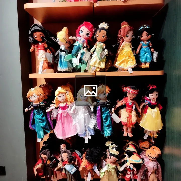 Colorful plush dolls on shelves