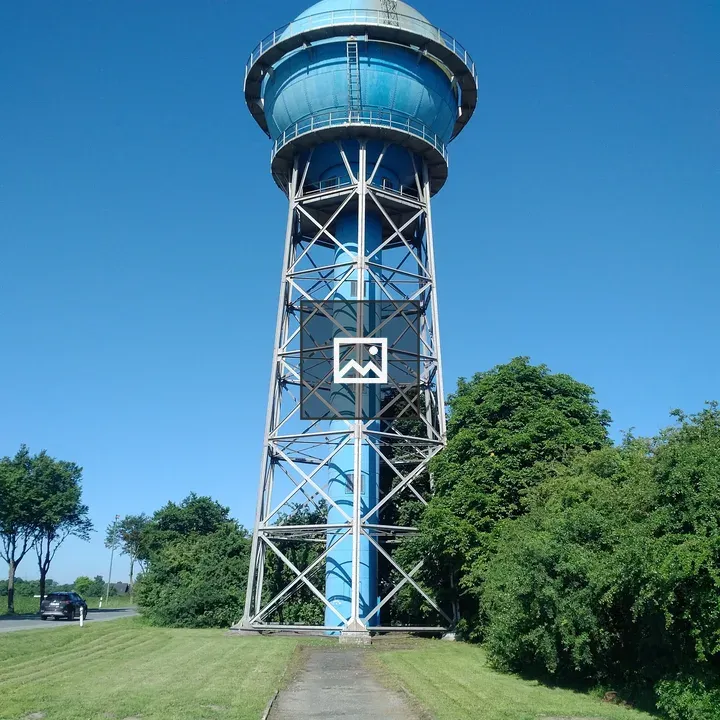 Blue water tower with metal supports