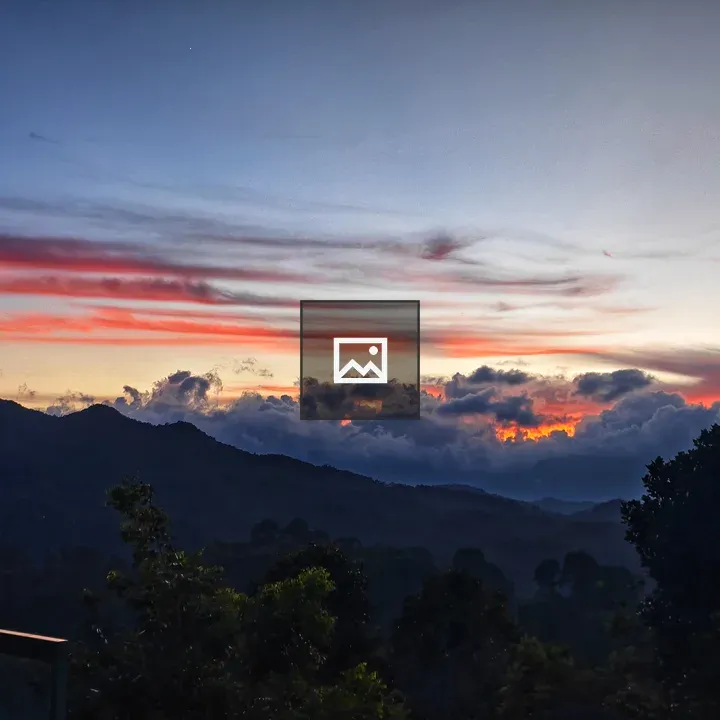 Mountain sunset with silhouetted trees