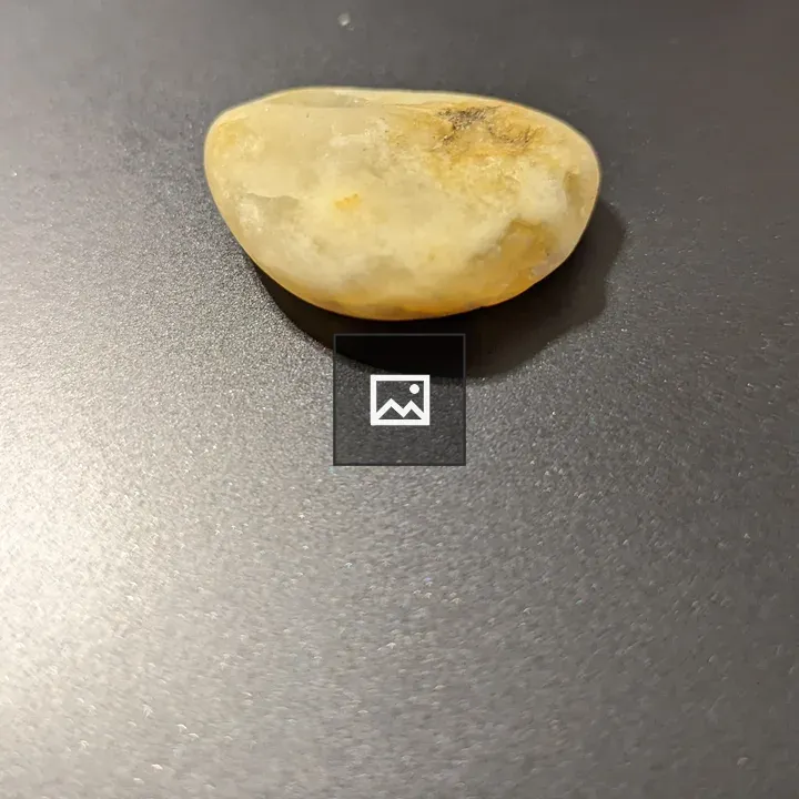 A small beige rock