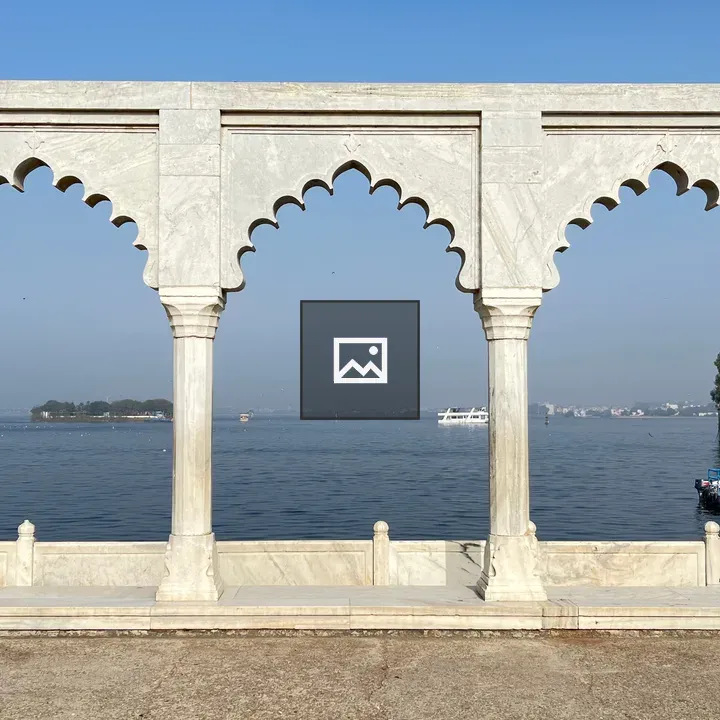 Marble Gate by Lake with Boats