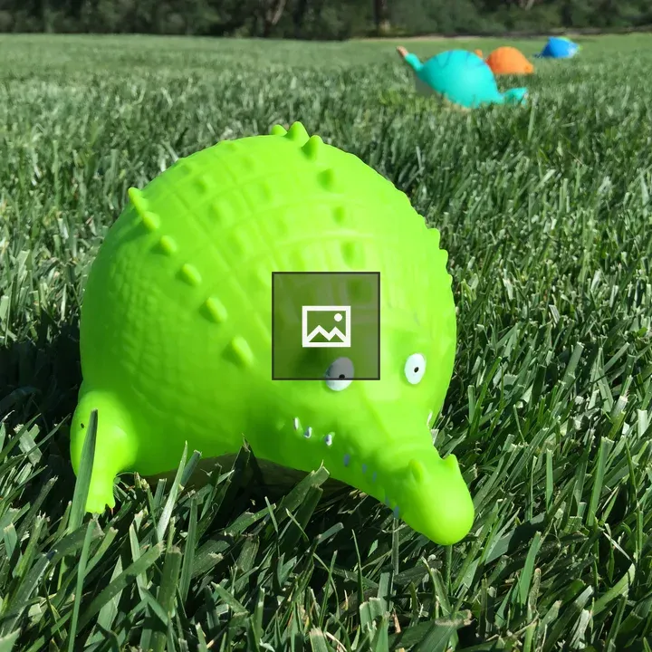 Plastic animal toys in grass