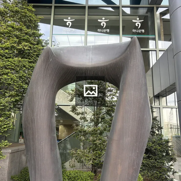 Modern sculpture arch in glass building