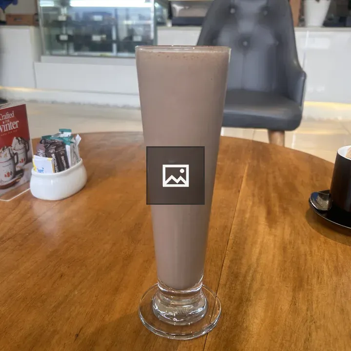 Chocolate milkshake on wooden table