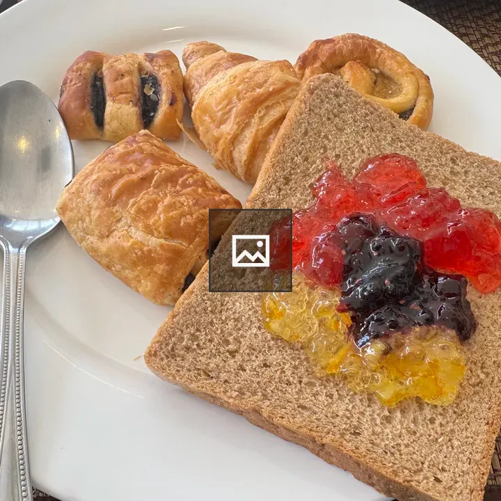 Toast with fruit jams and pastries