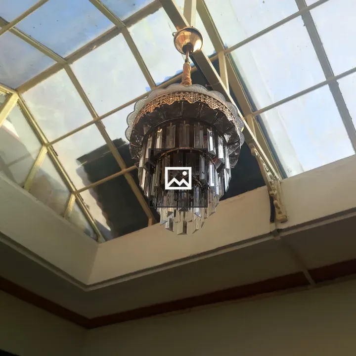 Vintage chandelier under skylight