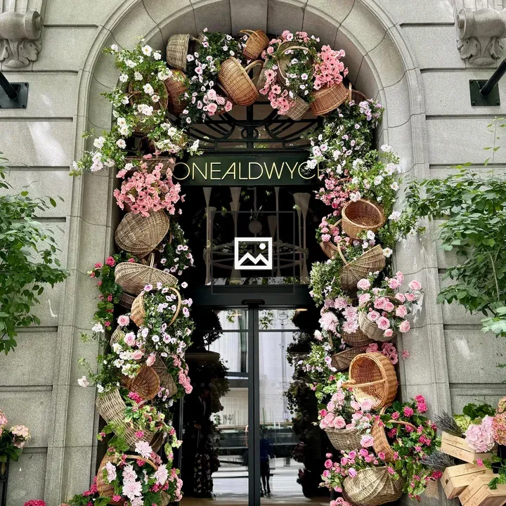 Ornate stone doorway with floral baskets