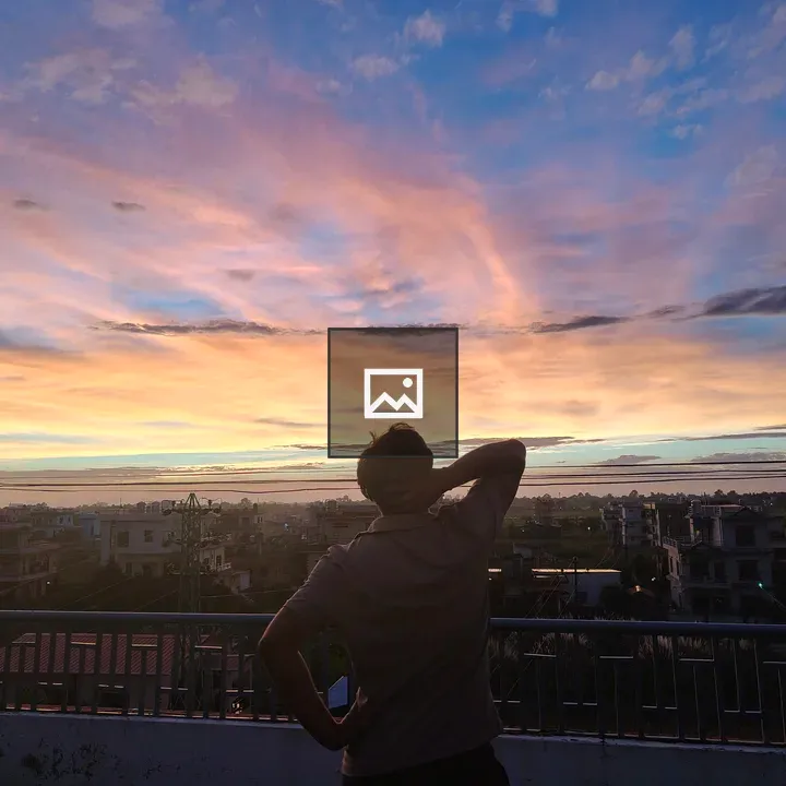 Person on Rooftop at Sunset