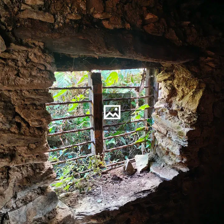 Arched window in weathered wall