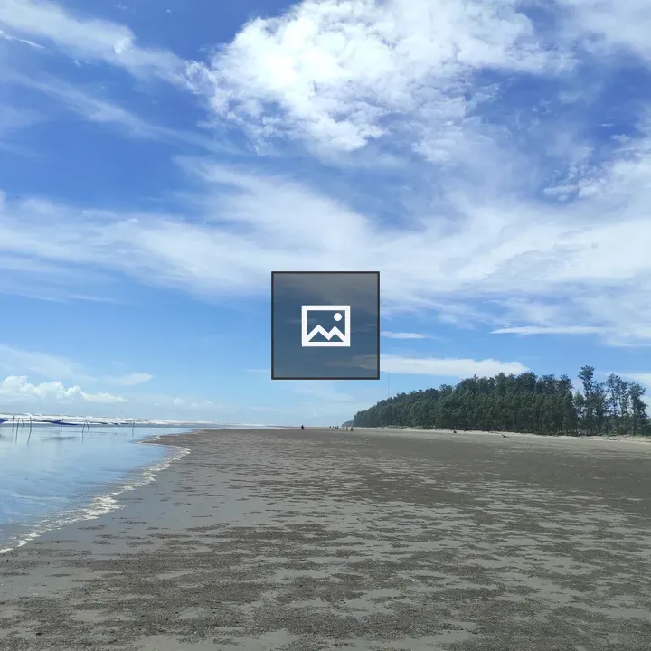 Wide Sandy Beach under Blue Sky