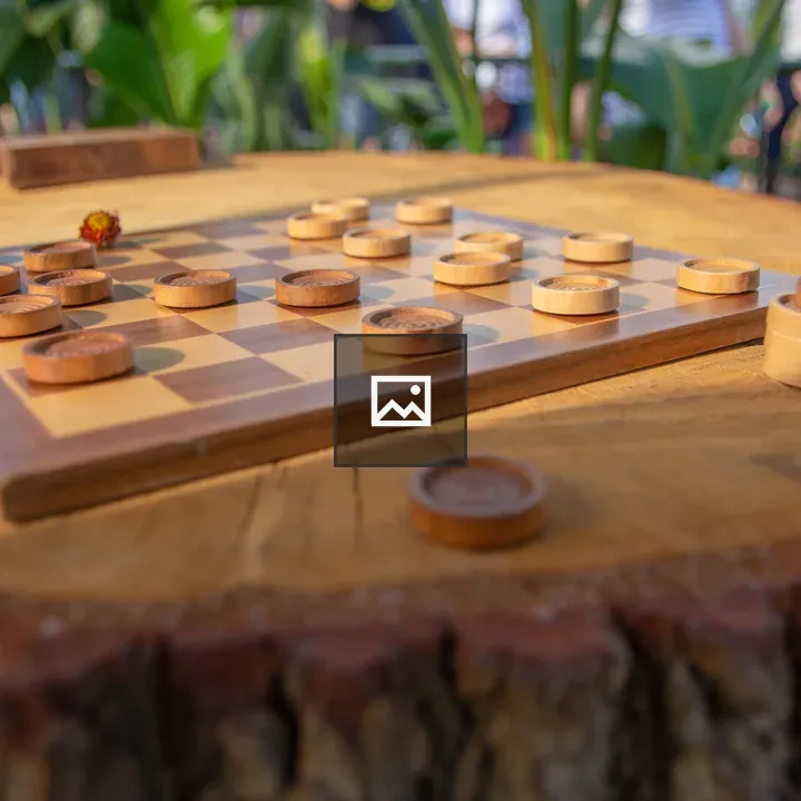 Wooden checkers on a stump