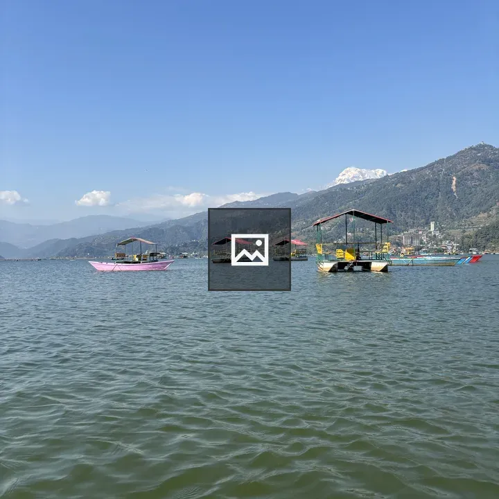 Serene lake with colorful boats