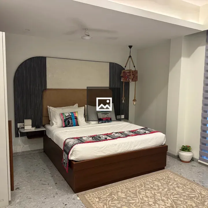 Bedroom with colorful pillows