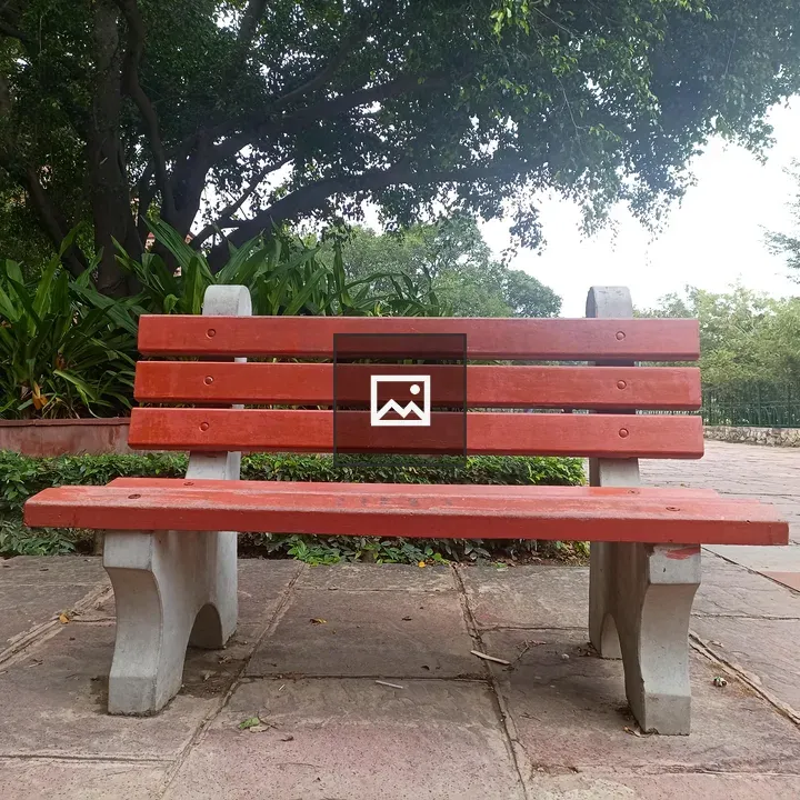 A cement bench in a park