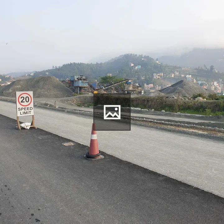Road construction site with sign