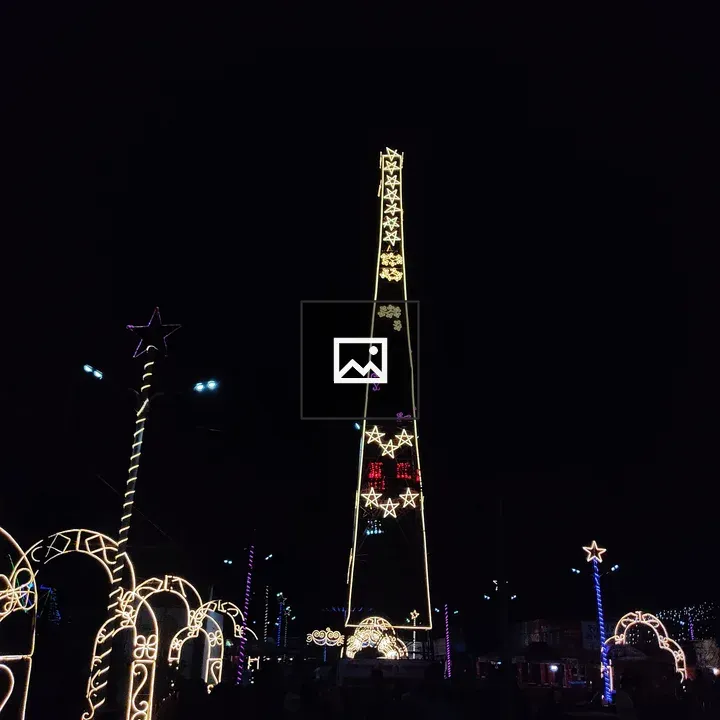 Tall illuminated tower with arches