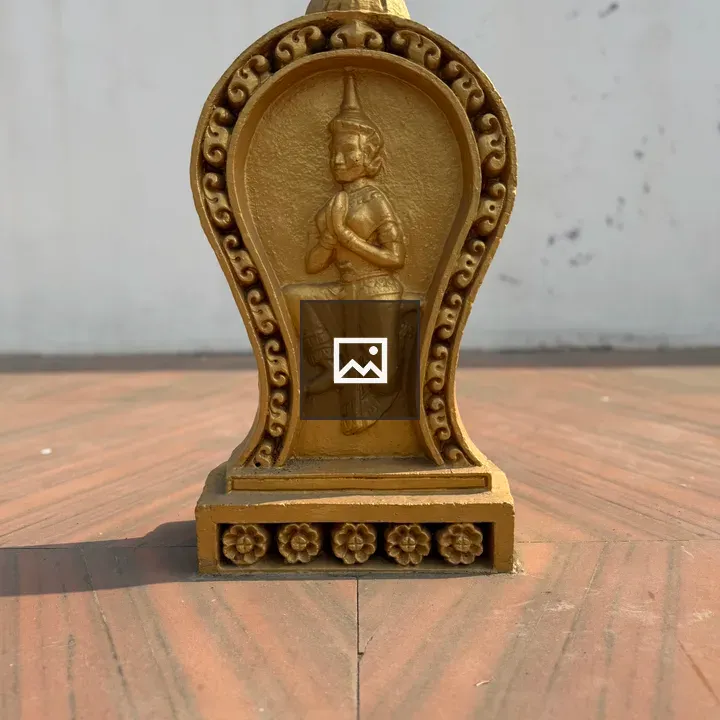 Golden statue in traditional pose