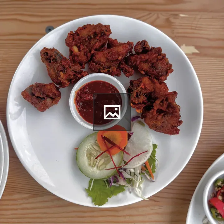 Plate with fried chicken and sauce