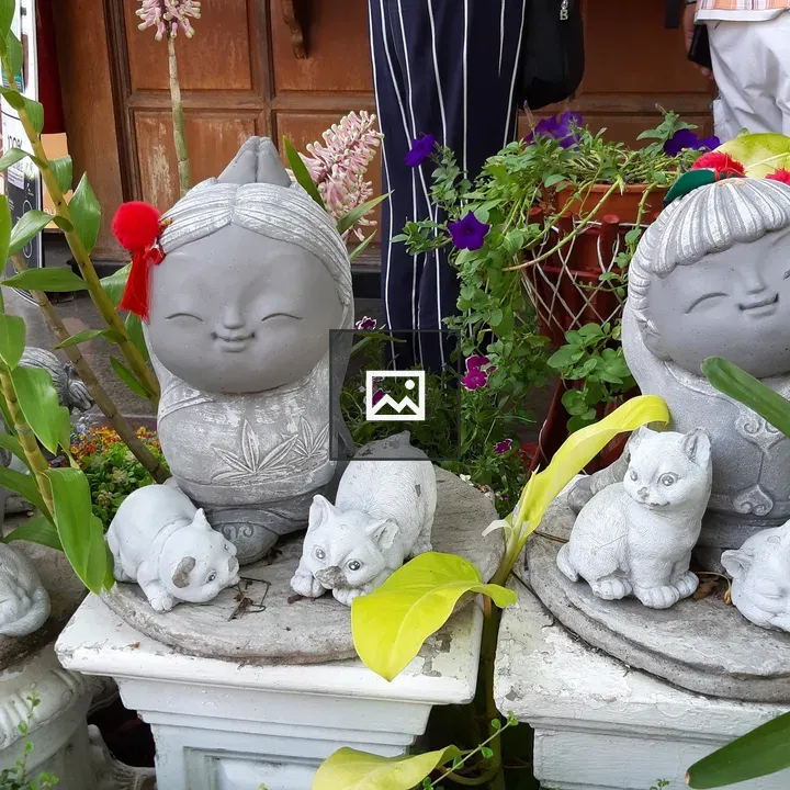 Group of stone statues of girls